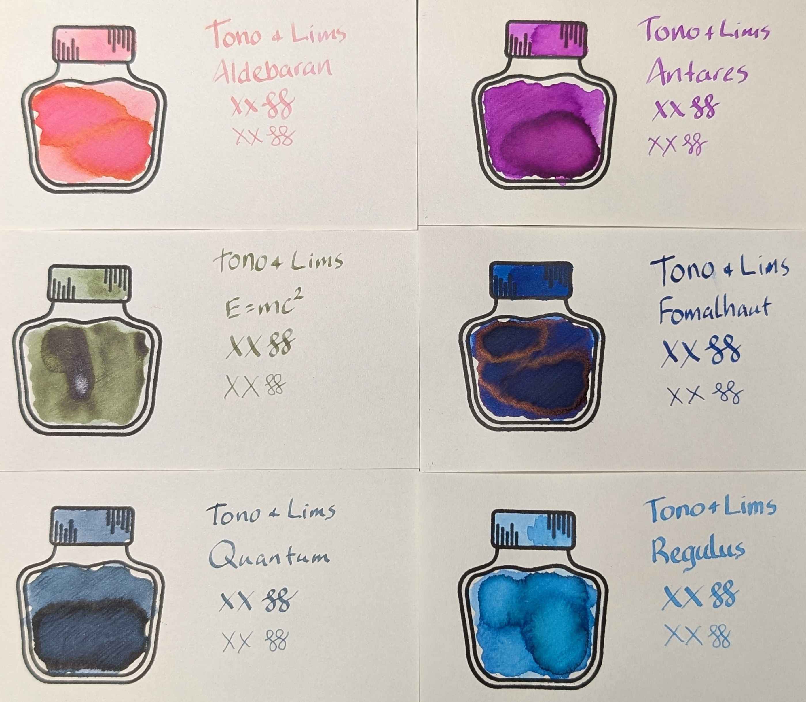Photo of six Midori MD fountain pen ink swatch cards arranged in three rows and two columns in natural light. Each swatch contains the brand ("Tono + Lims"), then the ink name followed by "XX" 2 curlicues in both stub and EF widths. Each card also contains a stamped outline of an ink bottle. The outlined area is mostly full of an ink blob that varies from ink to ink. The inks are: - Aldebaran, a coral ink that shades to pink and orange. - Antares, a fuchsia ink - E=mc², an olive green ink - Fomalhaut, a dark blue ink with red sheen - Quantum, a dark slate teal ink - Regulus, a light slate teal ink