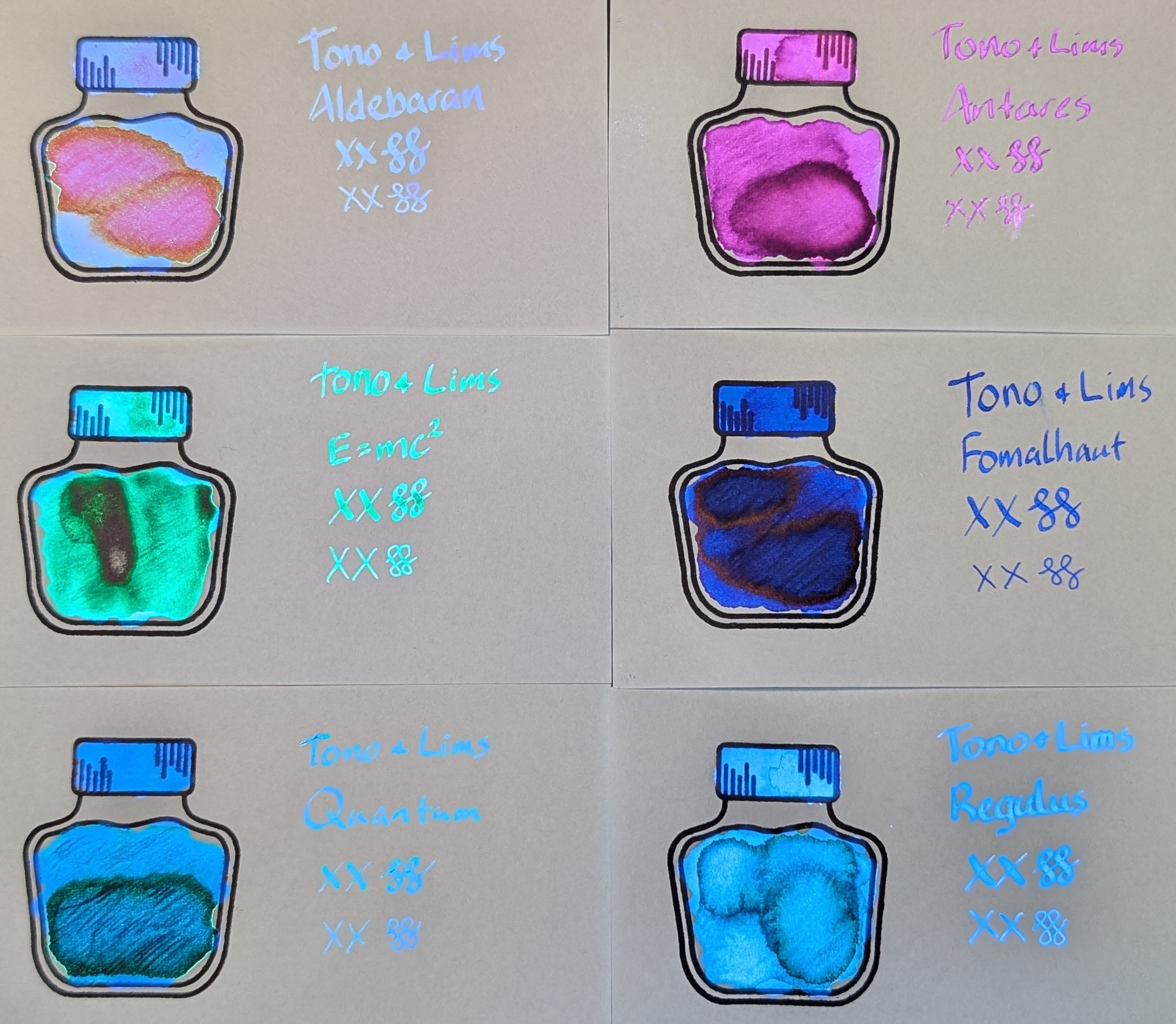 Same as the first photo but under a mix of natural and UV light Most things are the same except the inks are all glowing. The inks are: - Aldebaran text is glowing blue, portions of the swatch are glowing blue, pink, and orange - Antares is glowing purple and red in darker areas - E=mc² is glowing green with some small areas glowing more blue - Fomalhaut is glowing dark blue - Quantum is glowing blue with darker areas glowing teal - Regulus is glowing light blue