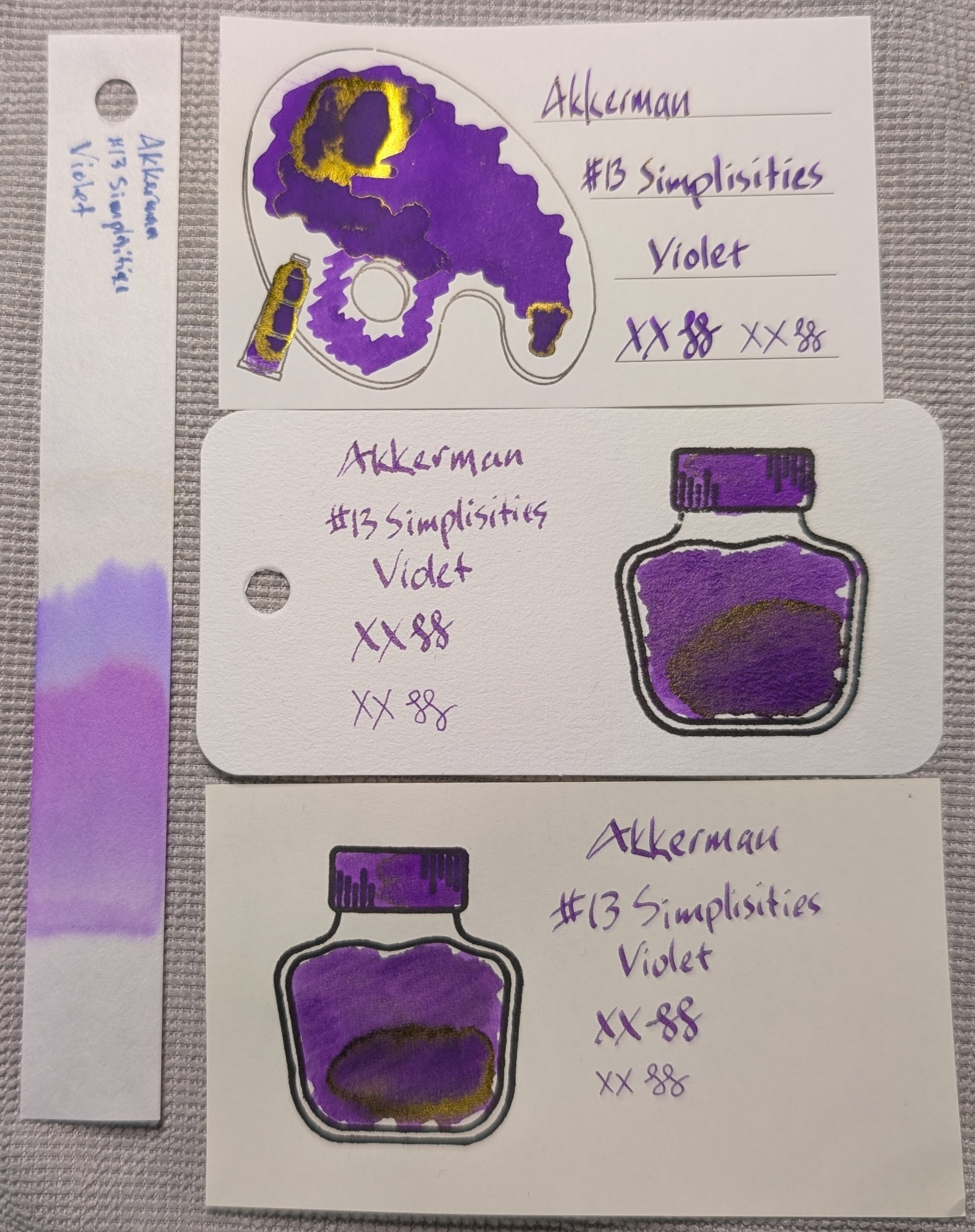 Photo of 3 ink swatches & chromatography strip for Akkerman #13 Simplisties Violet which is a "grape" purple colored ink with gold sheen. Each swatch contains the ink name followed by "XX" 2 curlicues in both stub and EF widths. Swatch 1: Iroful swatch card with an outline of a paint palette and tube. The palette is mostly filled in with swirls of ink, one area is darker and surrounded by a gold halo, two areas are even darker and outlined in thick shiny gold. There is an outline of a paint tube which is swabbed and looks like the darkest areas, with thick gold around the edges. The writing is even and dark. Swatch 2: Col-o-ring swatch card with a stamped outline of an ink bottle. The outlined area is mostly full of an ink blob which is darker in the lower right and that darker area has a slight gold sheen around it. Swab across "cap" is similar but without visible sheen. The writing sample is slightly lighter than Iroful. Swatch 3: Midori MD swatch card with a stamped outline of an ink bottle. The outlined area is mostly full of an ink blob which is darker in the lower right and that darker area has a visible gold sheen around it. Swab across "cap" is similar, but without visible sheen. Text is even and dark. Chromatography starts a more magenta purple, then changes to more of an indigo purple/blue before fading out.