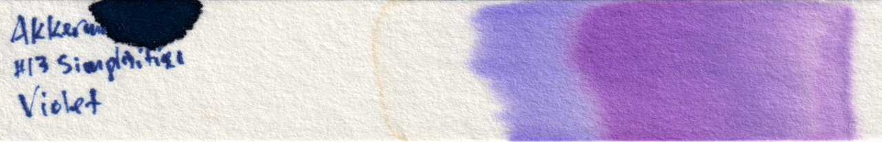 Chromatography strip showing dark purple, blue/purple, and a clear area with a gold line