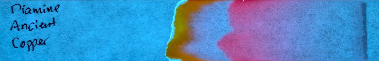 Photo of chromatography paper under UV light.