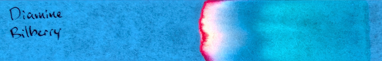 Photo of chromatography paper under UV light.