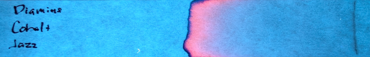 Photo of chromatography paper under UV light.