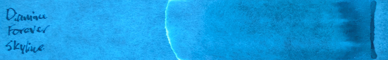 Photo of chromatography paper under UV light.