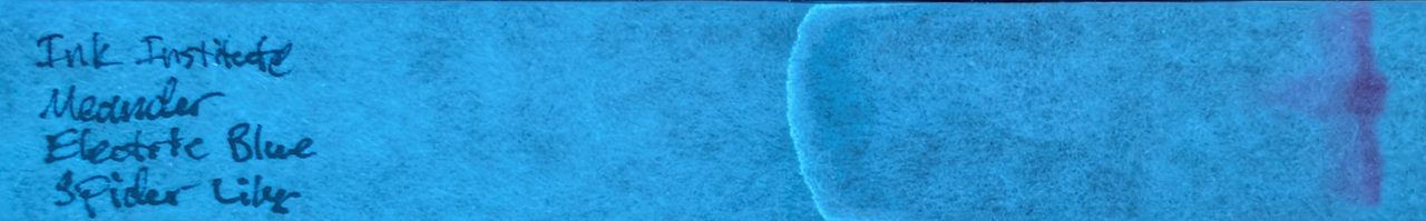 Photo of chromatography paper under UV light.