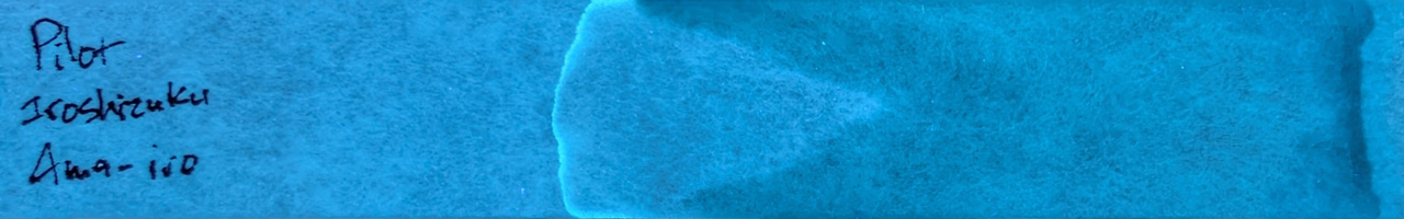 Photo of chromatography paper under UV light.