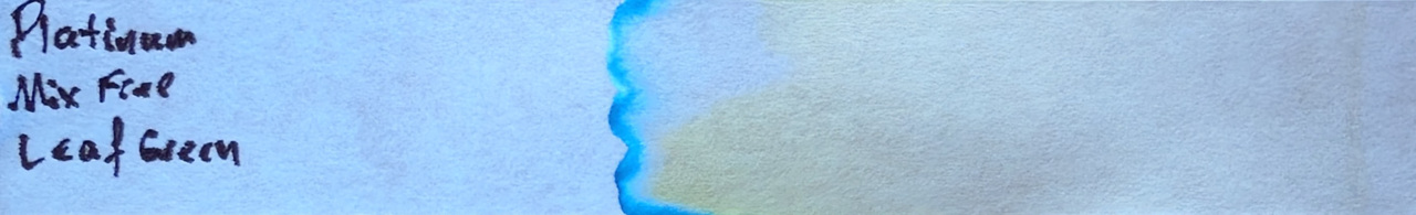 Photo of chromatography paper under UV light.