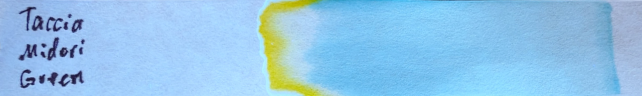 Photo of chromatography paper under UV light.